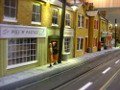 Ladies wait for a tram on the High Street