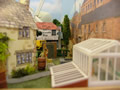 A back garden with the Old Curosity shop behind